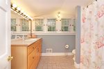Upstairs bathroom with a shower tub combo